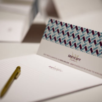 Mercure-branded notepaper set up ready for a meeting at a Mercure Hotel