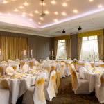 Tables dressed for a wedding in the ballroom on the park