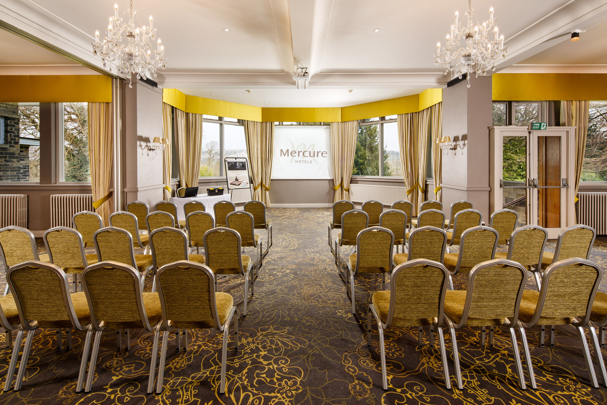 Tables with place settings for a luncheon in The Presidential Suite at mercure gloucester bowden hall hotel